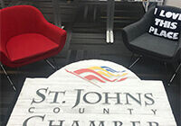 st john county chamber logo on table